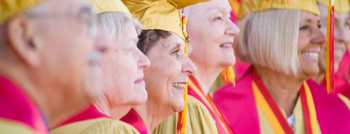 Graduates from the Class of 1956 pose for snapshots on-campus at their 50-year reunion.