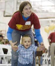 Project Homeless Connect volunteer and child
