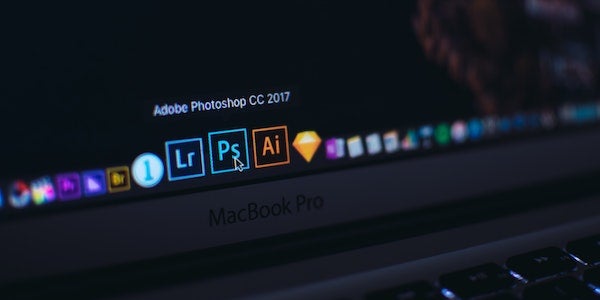 laptop with adobe creative cloud apps