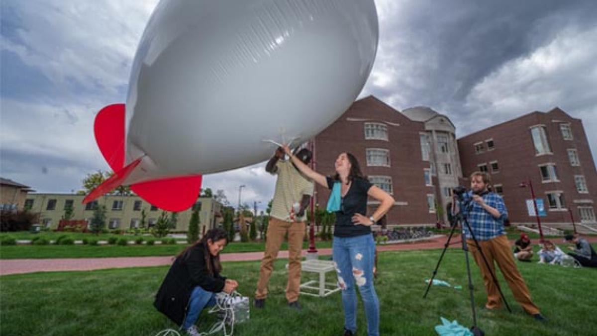 DU students working together to launch weather balloon