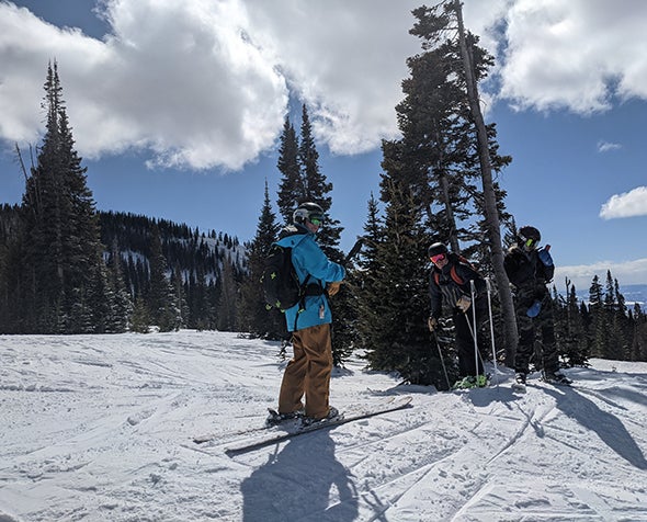 Three skiers at Arapahoe Basin