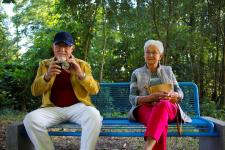 Senior man and woman on bench