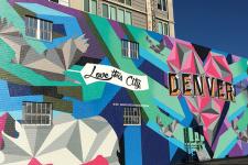 A mural reads "Love this City" and "Denver."