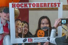 Students post for a photo at HocktoberFest