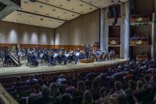 Audience and stage of a Lamont winter concert in Gates Hall.