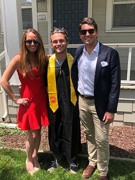 Millington posing in commencement garb