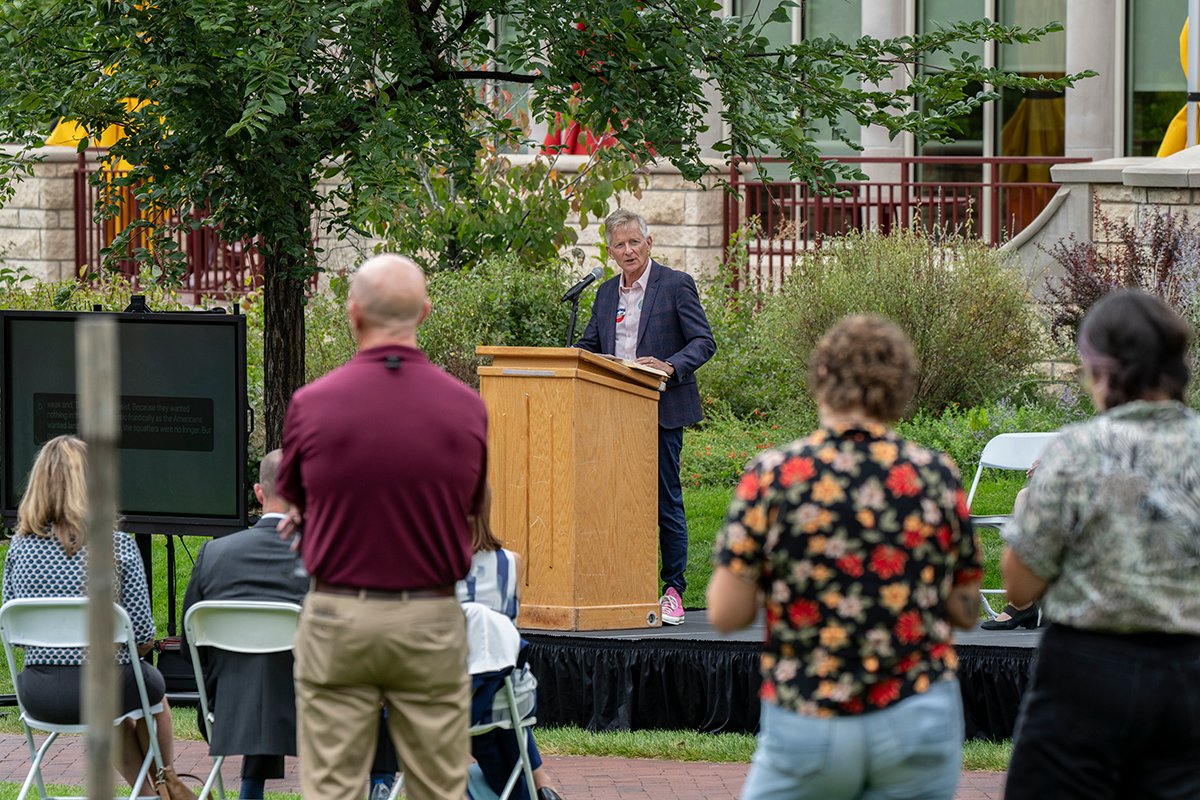 Chancellor Jermey Haefner reading from the Grapes of Wrath, a banned book, during a Constitution Day Event