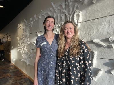 Canace poses for a photo with another person