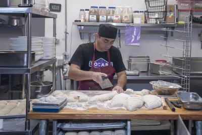 A cook preparing fry bread at Tocabe