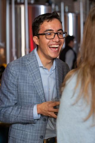 An attendee smiles at the Denver Difference NYC launch event