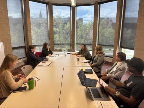 DU school board symposium School board members sit at a conference table