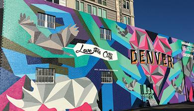 A mural reads "Love this City" and "Denver."