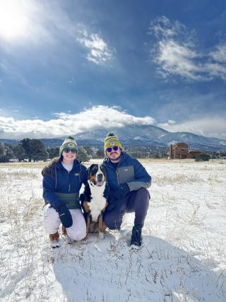 Emma Bourgraf poses with a person and a dog