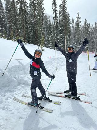 Haydee and another person pose for a photo while skiing