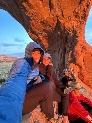 Salli Lubbe and a friend taking a selfie at Arches National Park