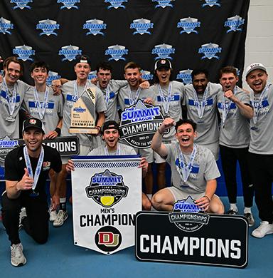 The men's tennis team poses for a photo after winning the Summit League.